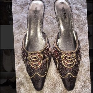 COPY - Backless high heels that cover toes.